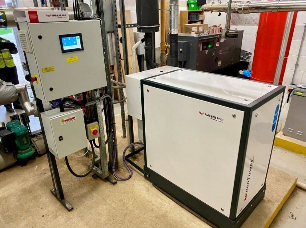 A room featuring the RMB Micro CHP machine in operation, showcasing its use in an energy-efficient setting.